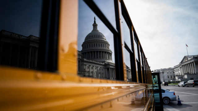 Photo with reflection of the Capital in the window, credit: The Washington Post
