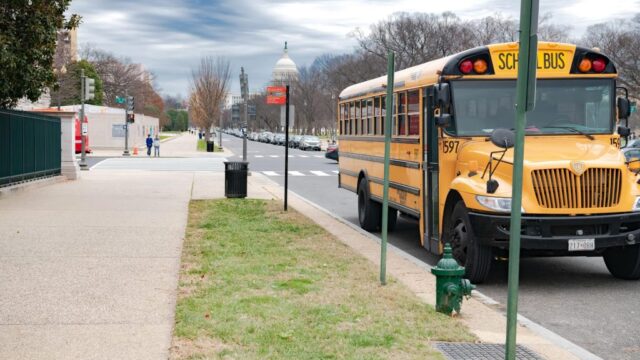 School Transportation News photo of school bus in front of U.S. Capitol