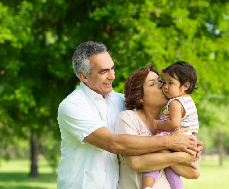 Grandparents holding grandchild