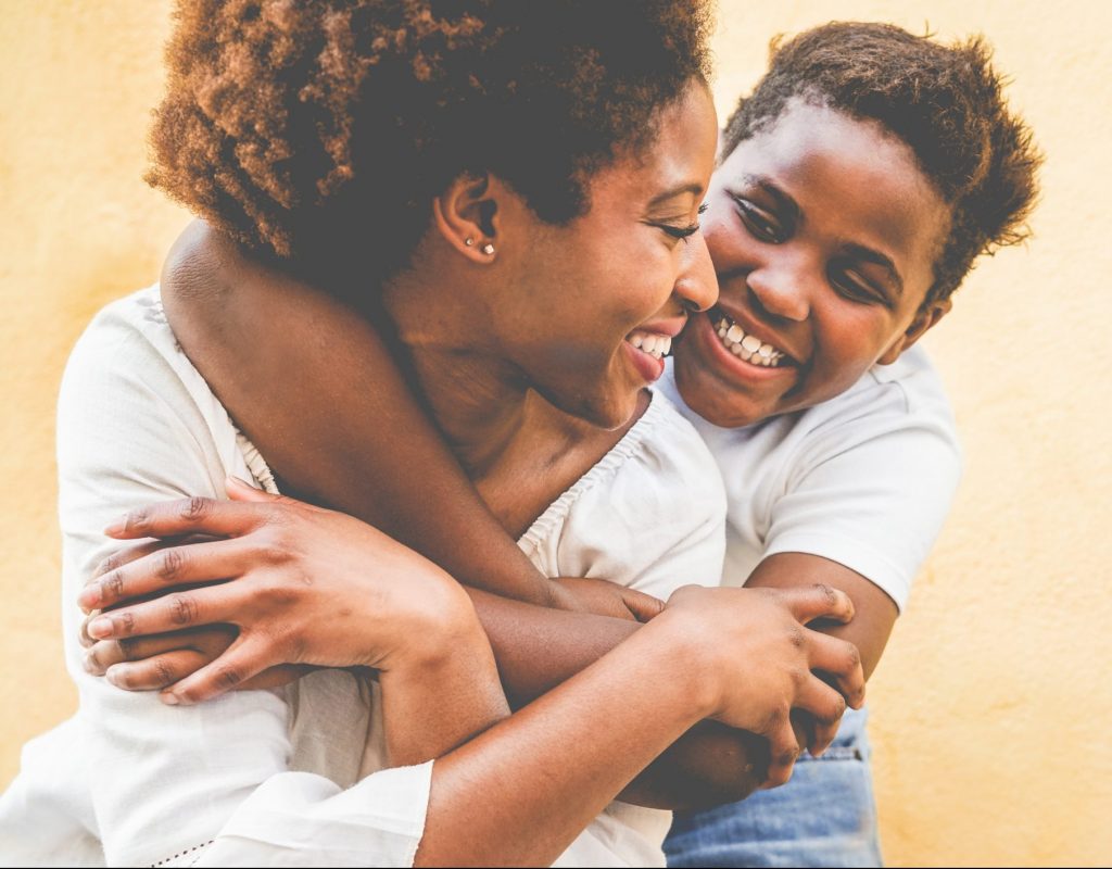 Mother and son hugging