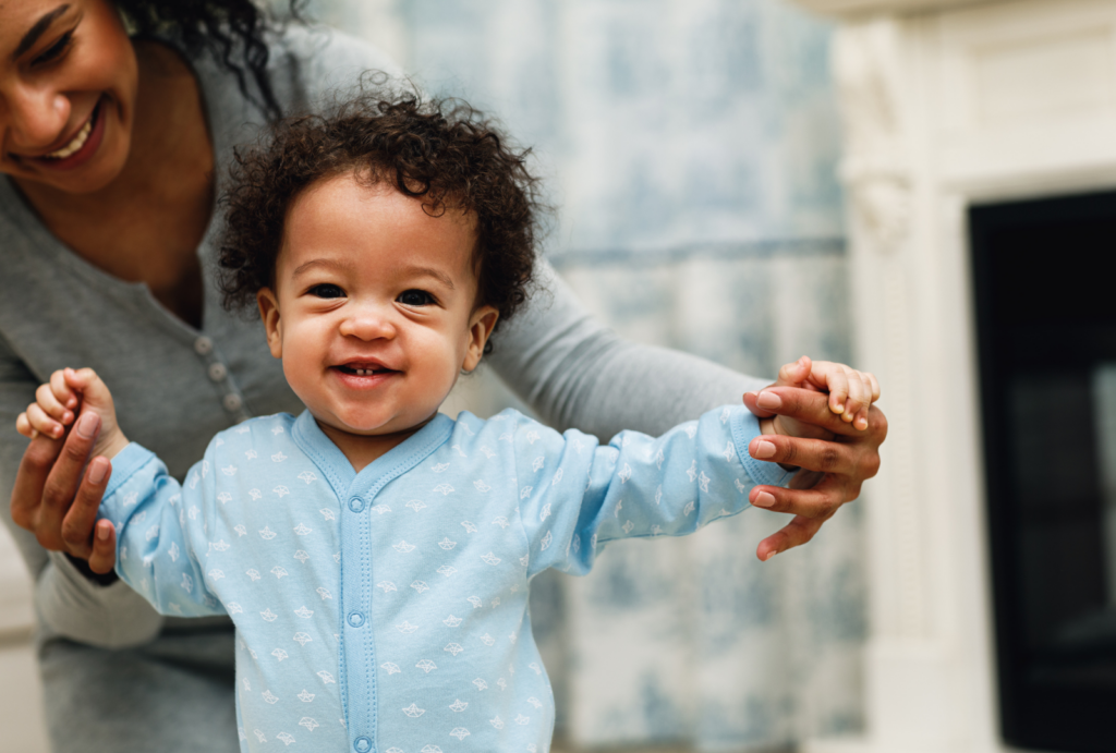 Infant walking with assistance