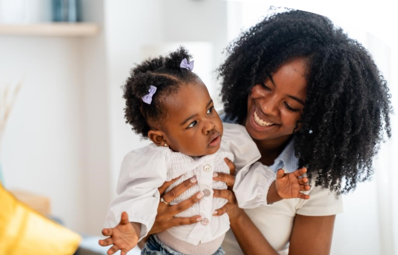 Mother holding young child
