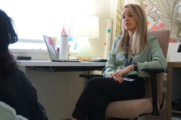 Briana D'Accurzio, a mental health therapist, meets with a student at a D.C. school.