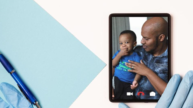 Photo of man and child on tablet screen.