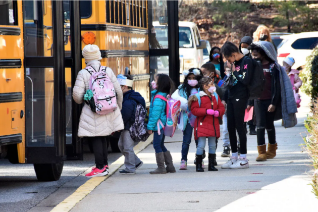 Photo of children getting on DC schoolbut.