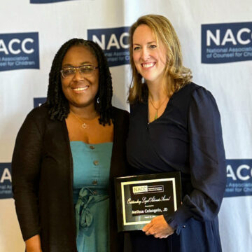 Chief Legal Officer LaShanda Adams stands next to Appellate Director Melissa Colangelo after Melissa receives NACC National Outstanding Legal Advocate Award