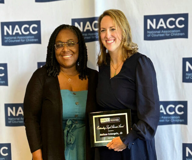 Chief Legal Officer LaShanda Adams stands next to Appellate Director Melissa Colangelo after Melissa receives NACC National Outstanding Legal Advocate Award.