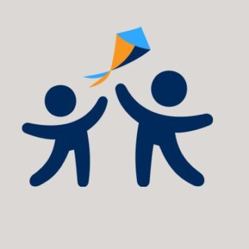 Icon of two people and a kite.