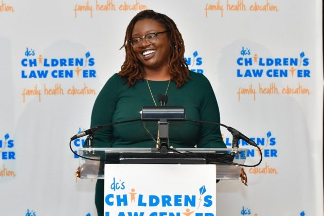Photo of Keisha speaking at the Helping Children Soar Annual Benefit.