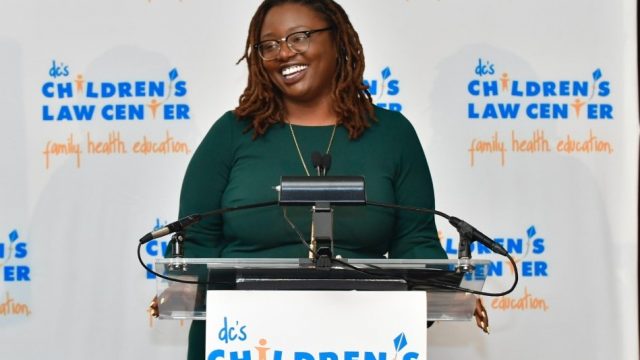 Photo of Keisha speaking at the Helping Children Soar Annual Benefit