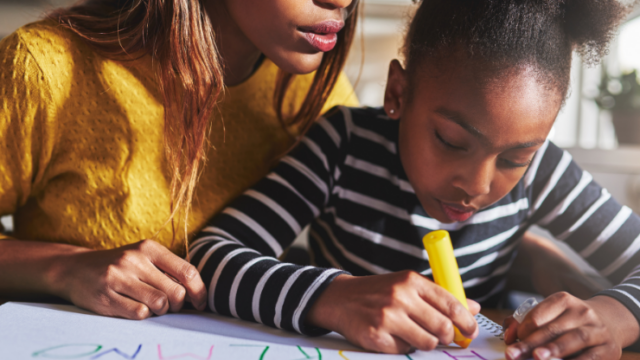 Mother and child learning the alphabet